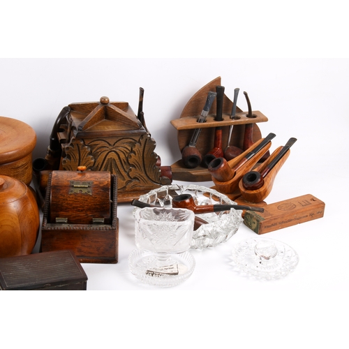 212 - A collection of assorted smoking ephemera. Including pipes, tabacco jars and ash trays, etc. Largest... 