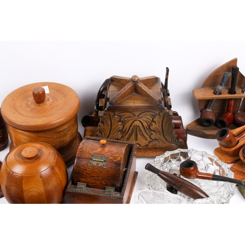 212 - A collection of assorted smoking ephemera. Including pipes, tabacco jars and ash trays, etc. Largest... 