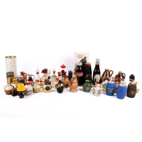 215 - A collection of assorted novelty ceramic or glass alcochol miniatures, many with contents. Including... 