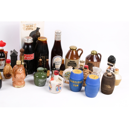 215 - A collection of assorted novelty ceramic or glass alcochol miniatures, many with contents. Including... 