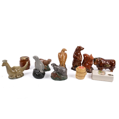 215 - A collection of assorted novelty ceramic or glass alcochol miniatures, many with contents. Including... 