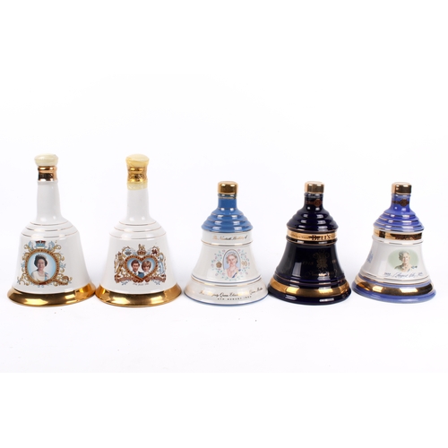 227 - A group of five assorted Royal Commemorative Bell's Scotch whisky decanters, all boxed. Consisting o... 