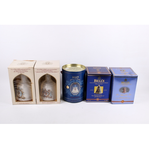 227 - A group of five assorted Royal Commemorative Bell's Scotch whisky decanters, all boxed. Consisting o... 