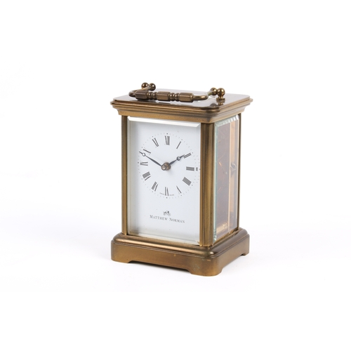 236 - A modern Matthew Norman carriage clock, with fitted box, key and instructions. The clock with black ... 
