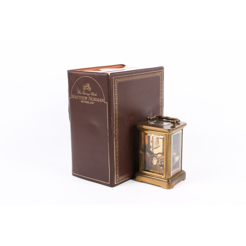 236 - A modern Matthew Norman carriage clock, with fitted box, key and instructions. The clock with black ... 