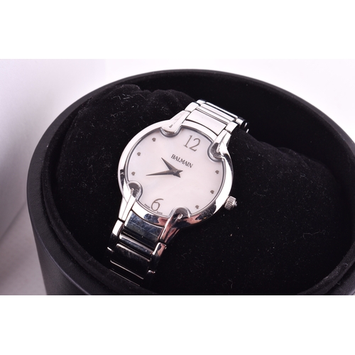 180 - A Balmain lady's wristwatch with two boxes. With silver markers to the mother of pearl type face and... 