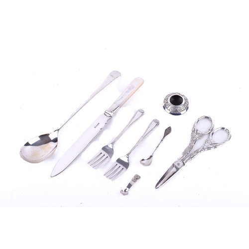 183 - A small group of assorted silver mounted and white metal items. Including a cake knife with silver c... 
