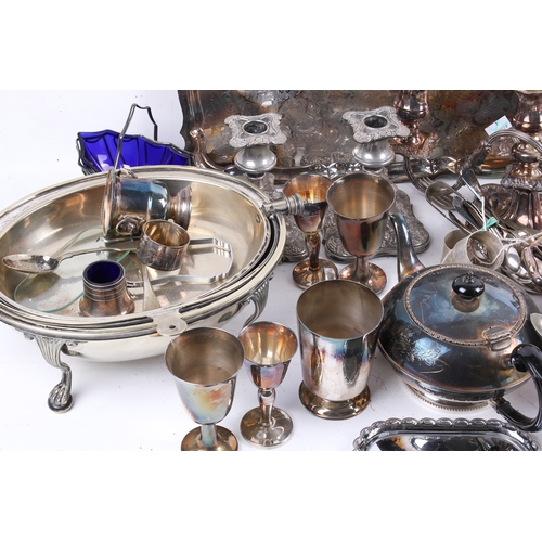 191 - A box of assorted silver plate. Including a pair of candlesticks, a tea pot and a tray, etc. Largest... 