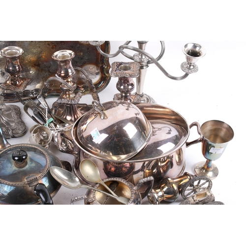 191 - A box of assorted silver plate. Including a pair of candlesticks, a tea pot and a tray, etc. Largest... 