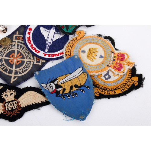 21 - A collection of post-war military patches and badges. Including examples from the RAF, The Royal Air... 