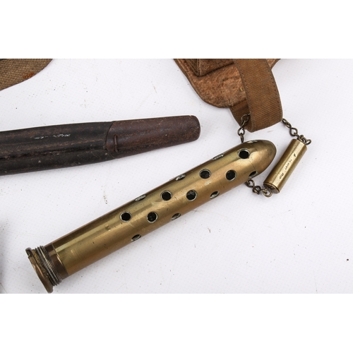32 - An assortment of 20th century militaria. Comprising morse code tappers, a cut bayonet in a leather s... 