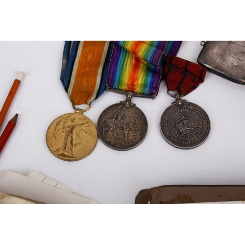 35 - A group of World War medals, a silver vesta and ephemera. Including a Victory Medal and British War ... 