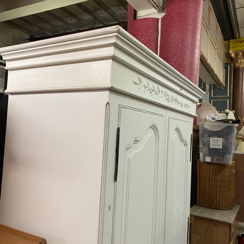 81 - White double wardrobe with ornate carvings on top with metal handles with keys