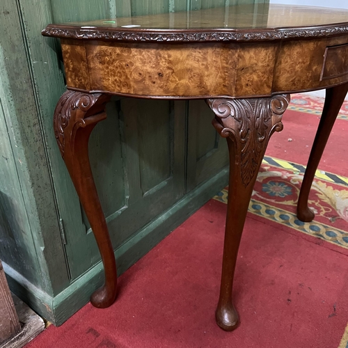 17 - Walnut and mahogany half moon console table with single drawer front on Queen Anne legs