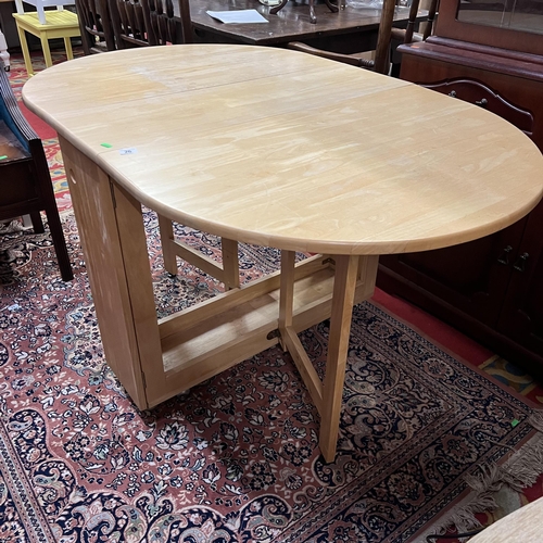 26 - Beech drop leaf table on castors