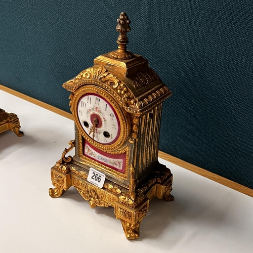 266 - Early gilt metal and porcelain Clock garniture set depicting Dutch scenes