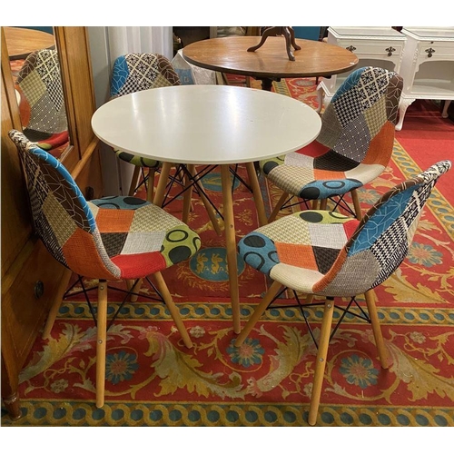 9 - Circular designer dining table and four designer chairs