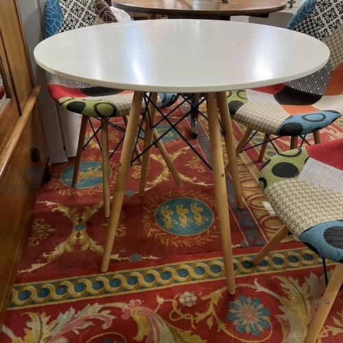 9 - Circular designer dining table and four designer chairs