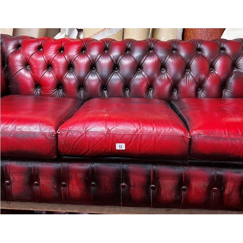 13 - Three seater Chesterfield settee in ox blood red leather