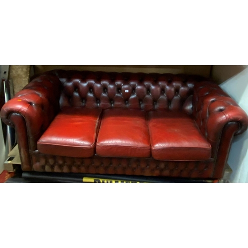 14 - Three seater Chesterfield settee in ox blood red leather