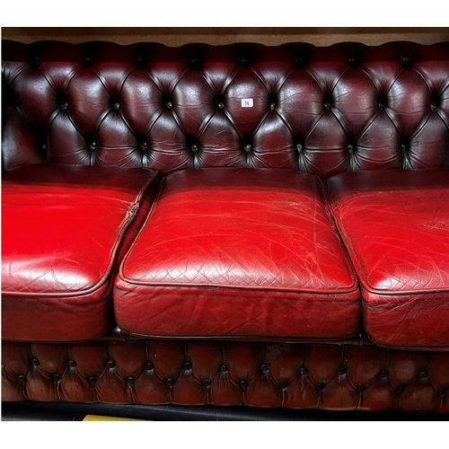 14 - Three seater Chesterfield settee in ox blood red leather