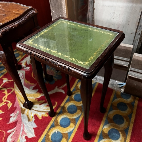 18 - Mahogany heavily carved nest of three tables with glass tops - with two other carved and glass top t... 