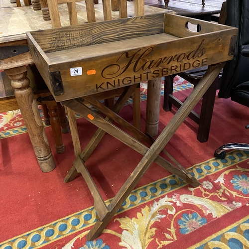 24 - Harrods serving tray on stand in pine with metal corners on fold away stand