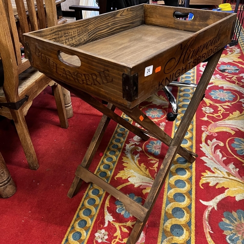 24 - Harrods serving tray on stand in pine with metal corners on fold away stand