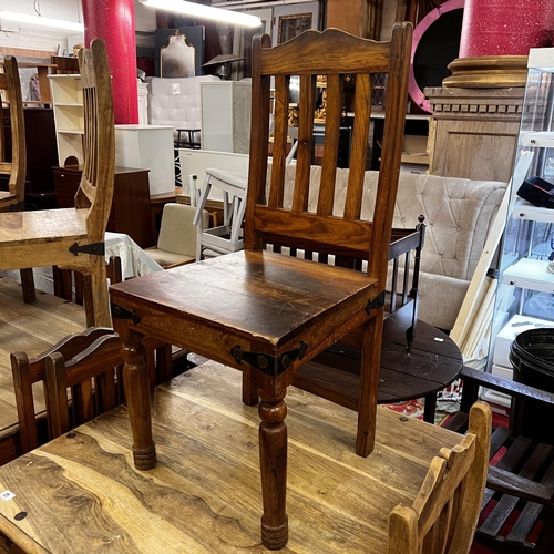 25 - Rustic table and four chairs with wrought iron corners and studded top