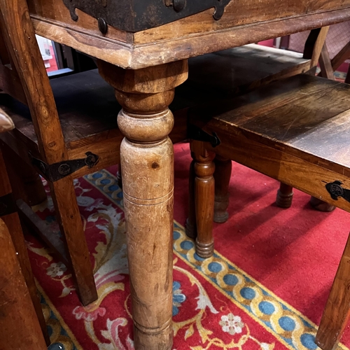 25 - Rustic table and four chairs with wrought iron corners and studded top