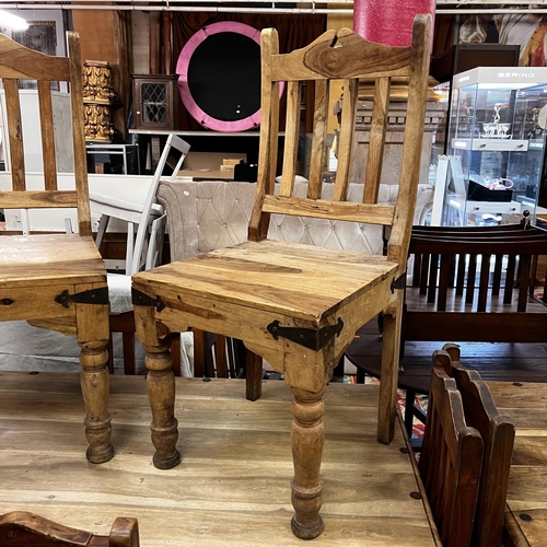 26 - Rustic table and six chairs with wrought iron corners and studded top