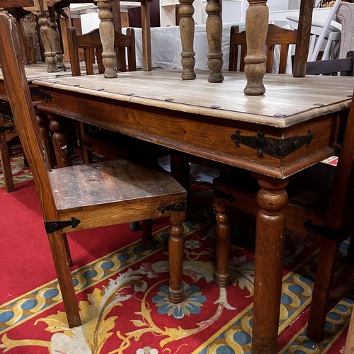 26 - Rustic table and six chairs with wrought iron corners and studded top