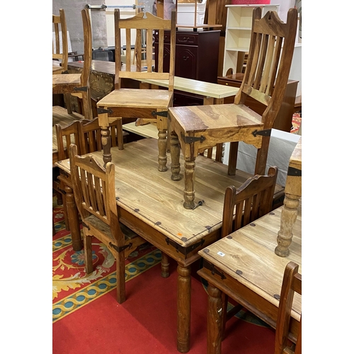 27 - Rustic table and six chairs with wrought iron corners and studded top