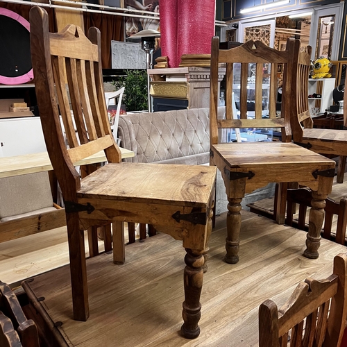 27 - Rustic table and six chairs with wrought iron corners and studded top