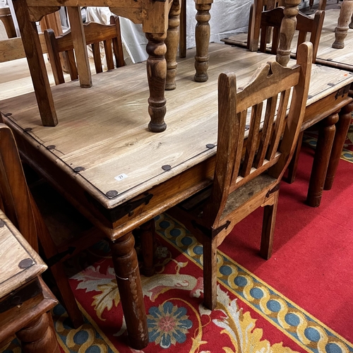 28 - Rustic table and six chairs with wrought iron corners and studded top