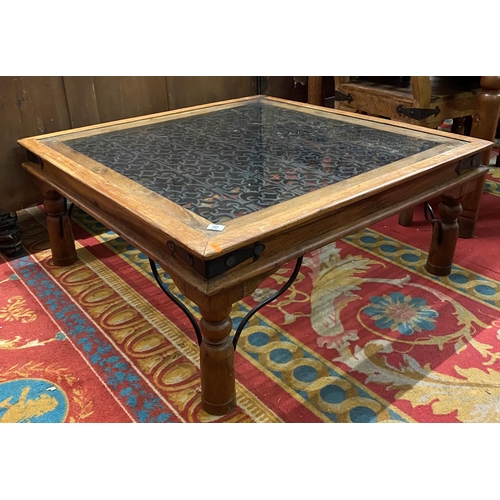 30 - Rustic coffee table with glass top and wrought iron centre and fittings