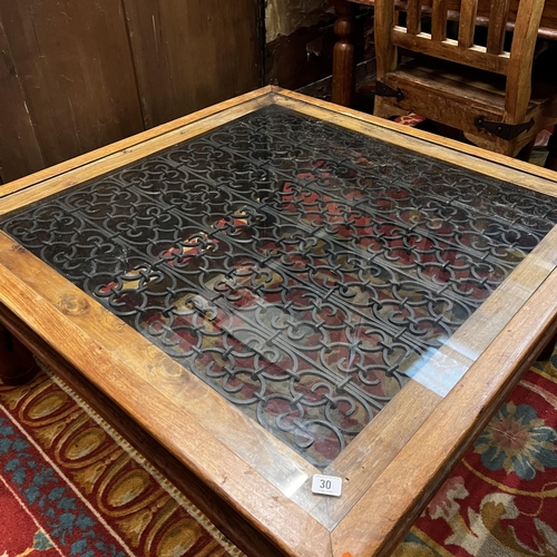 30 - Rustic coffee table with glass top and wrought iron centre and fittings