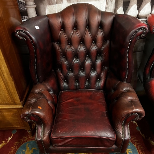 31 - Oxblood red Chesterfield leather winged back armchair on Queen Anne legs