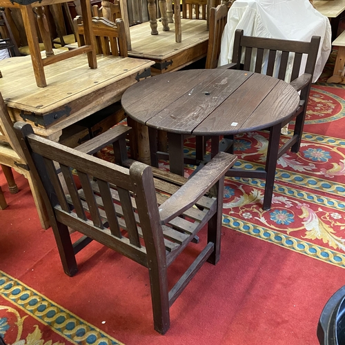 39 - Garden table and matching chairs in teak