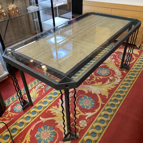 40 - Wrought iron and oak dining table with glass top