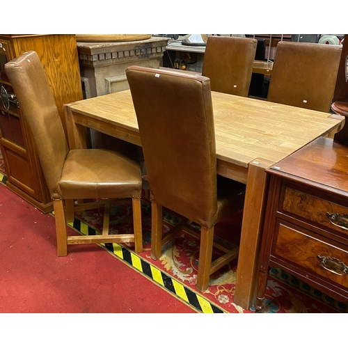 1 - Golden oak dining table with four brown leather chairs