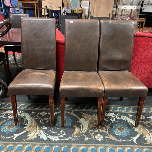 18 - Three high back brown leather chairs