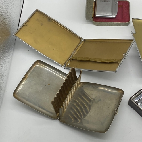 189J - Three cigarette cases one with lighter and two other lighters