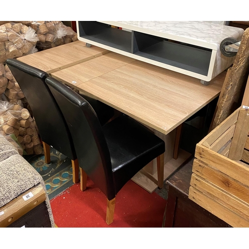 37 - Extending dining table with four black leather chairs