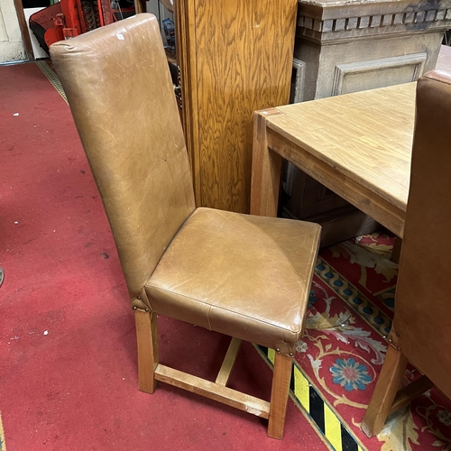 1 - Golden oak dining table with four brown leather chairs