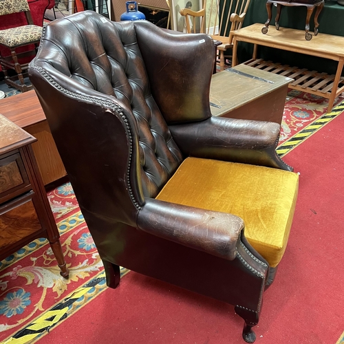 3 - Chesterfield winged back distressed armchair