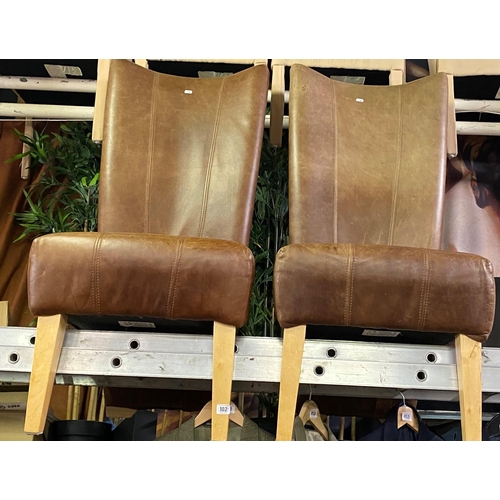 102 - Pair of brown leather high back dining chairs