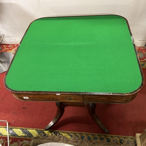 116 - Victorian rosewood fold over games table with brass inlay on splay legs and brass castors