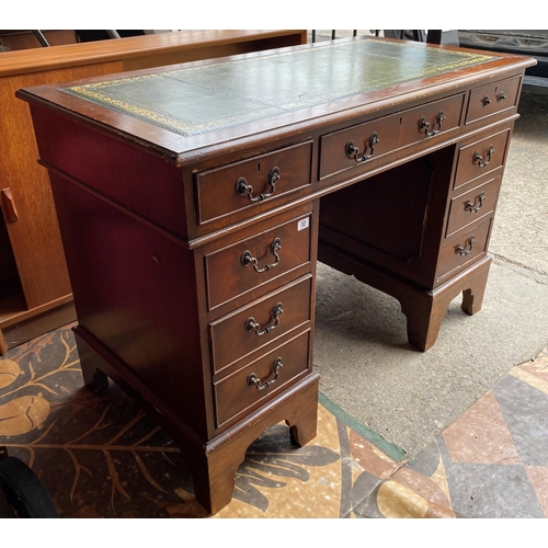 32 - Mahogany green leather top double pedestal desk