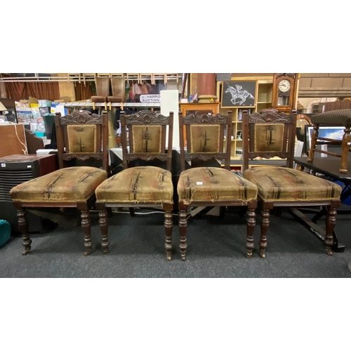 337 - Set of four heavily carved Edwardian mahogany chairs with overstuffed seats in original condition